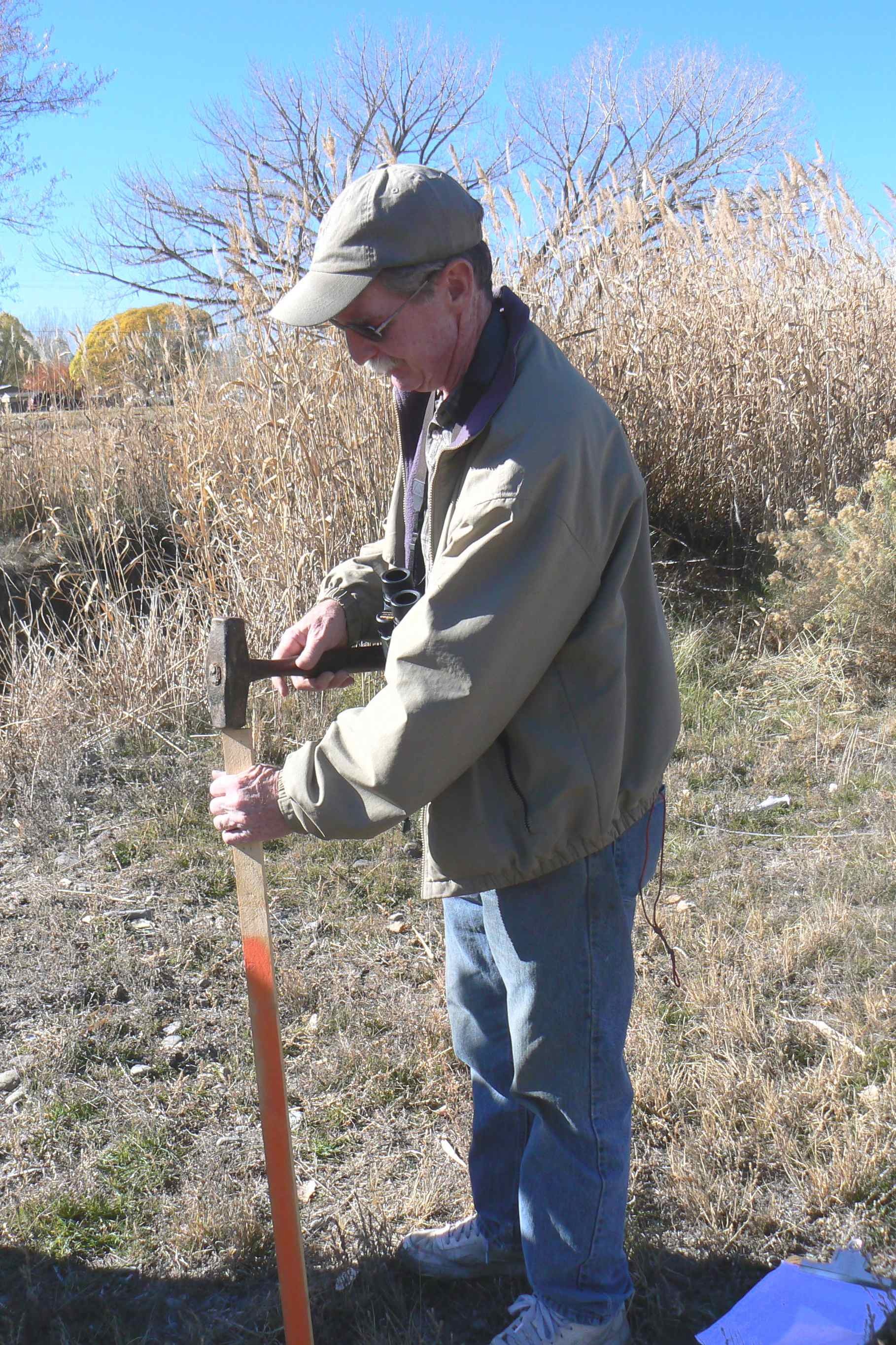 Jon Horn pounding stake